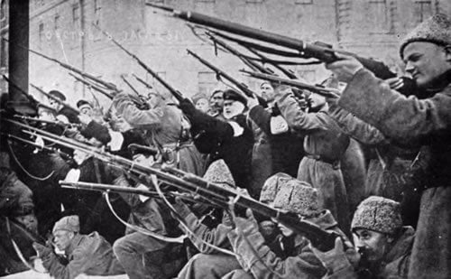Revolutionaries take up arms against Tsarist police during the early days of the February Revolution in Petrograd.