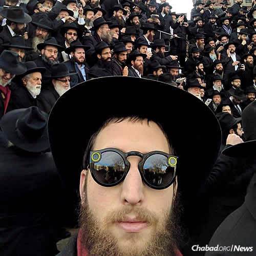 Lightstone sports “Spectacles by Snap”—Snapchat sunglasses that record life from the wearer’s point of view and can wirelessly transmit photos or video to a cell phone—at the annual fall conference for Chabad-Lubavitch emissaries in Brooklyn, N.Y.