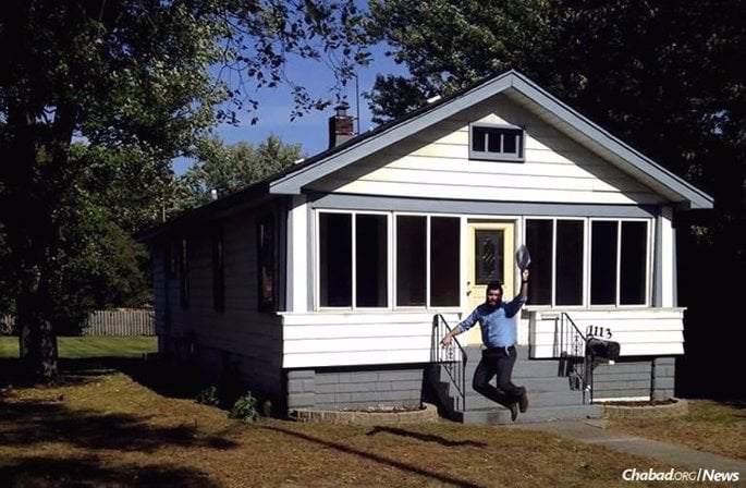 Rabbi Eliezer Zalmanov, co-director of Chabad of Northwest Indiana with his wife, Chanie, jumps for joy back in October 2015, when this property was purchased for Chabad in the small town of Munster.