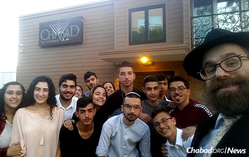 Part of the Dimona group gathers for a selfie at the Chabad House before Shabbat.