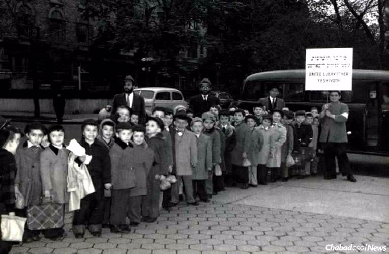 The first Lag BaOmer parade in 1953 in the Crown Heights neighborhood of Brooklyn, N.Y., left an indelible impression upon 5-year-old Yosef Minkowitz, second from left. The Rebbe—Rabbi Menachem M. Schneerson, of righteous memory—spoke directly to him and other Jewish schoolchildren with a passion Minkowitz recalls to this day. (Photo from the book “40 Years”)