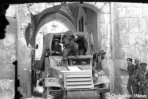 Israeli paratroopers enter the Old City of Jerusalem through Lion’s Gate on June 7, 1967, reuniting it after 19 years of Jordanian occupation and placing it under Jewish control for the first time in two millenia. (Photo: Ilan Bruner/Israel Government Press Office)
