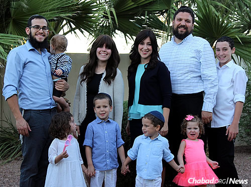 The Tiechtels and the Rimlers, Chabad-Lubavitch emissaries who serve students at Arizona State. Top, from left: Rabbi Mendy Rimler holding Eli Rimler, Sarah Rimler, Chana Tiechtel, Rabbi Shmuel Tiechtel, Tzvi Tiechtel. Bottom, from left: Chayala Rimler, Meir Tiechtel, Levi Tiechtel, Mina Tiechtel.