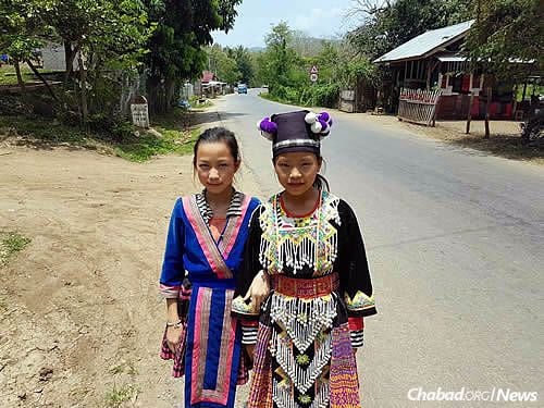 Many in Laos still cling to their customary dress.