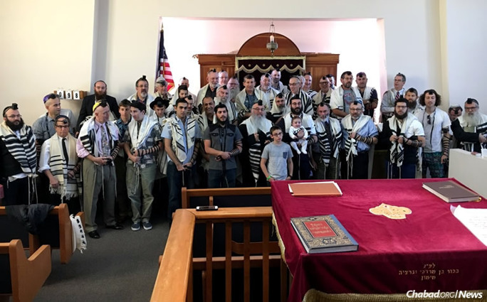 A group shot of some of those who participated in Shacharit prayers as a surprise for Rabbi Yossie Shemtov, executive director of Chabad of Tucson, Ariz., who recently celebrated his 60th birthday.