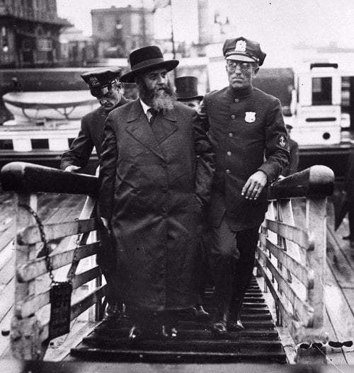 The rebbe is escorted by police upon his arrival in New York. Thousands awaited him at the pier. September 18, 1929.
