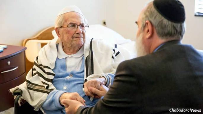 Max Gergel, left, and Rabbi Hesh Epstein, co-director of Chabad of South Carolina in Columbia, have known each other for 30 years. Earlier this month, the rabbi helped Gergel fulfill a lifelong goal: formally celebrating his bar mitzvah and wrapping tefillin for the first time. (Photo: Tracy Glantz/The State)