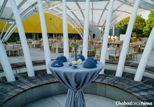 The tables were elegantly set outdoors, despite the impending inclement weather. (Photo: Avraham Edery)