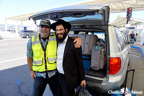 Arriving at the airport in California, where a man from a neighboring Jewish community came to pick them up.