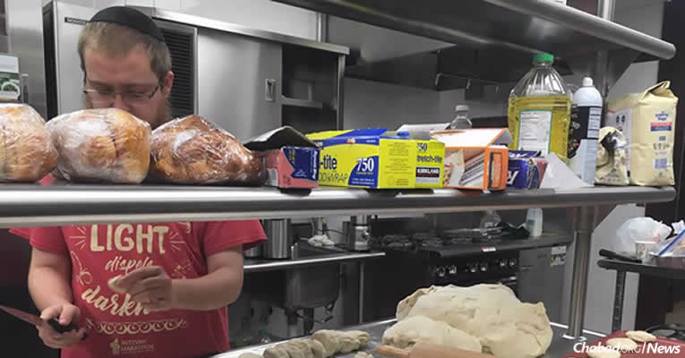 A volunteer at Aishel House at the Texas Medical Center in Houston prepares kosher food for flood victims. With stores that typically carry kosher-food items under water, staples and supplies are not available.
