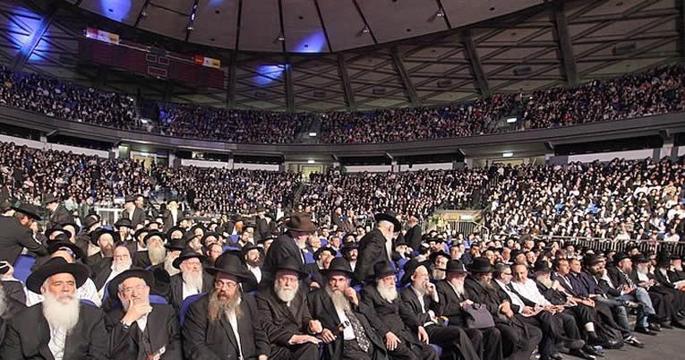 From homes to synagogues to vast arenas like the one above in Israel, gatherings around the world mark the completion of the annual study of Maimonides’ Mishneh Torah. (File photo)