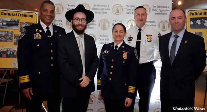 At the inaugural Jewish Uniformed Service Association of Maryland (JUSA) Law Enforcement and Military Appreciation Awards Dinner honoring Jewish police, fire and military members are, from left: Baltimore Police Deputy Commissioner Darryl Desousa, Rabbi Chesky Tenenbaum, Baltimore Police Department Chief Melissa Hyatt, Baltimore Police Deputy Commissioner Dean Palmere and Baltimore Police Detective Jeremy Silbert.