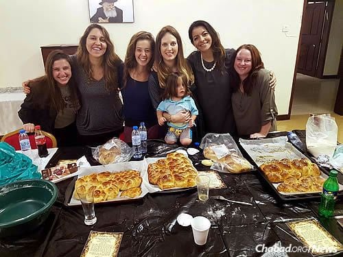 Yocheved Raskin, fourth from left, is organizing challah-making workshops and other programs for women.