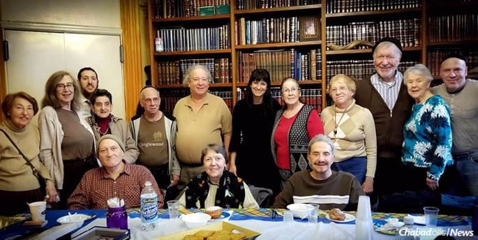 “Senior Kluger Club”: A group of older men and women come to Chabad of Brooklyn Heights, N.Y., once a month to participate in a Jewish educational program or activity. Some of them also receive weekly “Stoop Soup” kosher care packages.