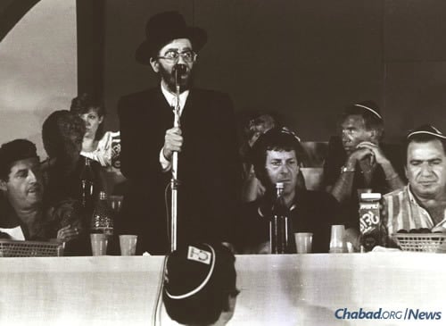 Addressing attendees at a function in Israel