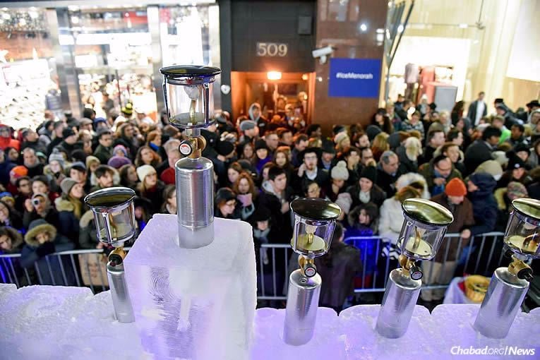 Huge crowds came for the lighting of the ice menorah in Midtown Manhattan, where some 600 doughnuts and 900 latkes were also served.