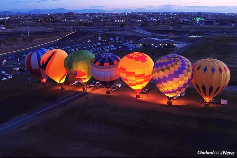 It was high flying as Chabad of New Mexico in Albuquerque held a “Chanukah Night Glow” event on Dec. 17, where hot-air balloons formed a rather unusual, though stunningly beautiful, menorah in the sky.