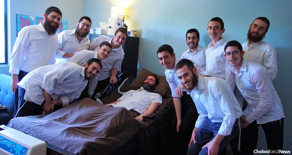 A group of students from Ohr Elchanan Chabad yeshivah in California, whose lives have been touched by their daily praying, singing and learning interactions with Rabbi Yitzi Hurwitz, center, thought about what they could do for their mentor and friend’s birthday. (Photo: Monika Lightstone)