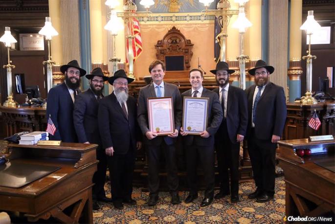 From left: Rabbis Bentzion Shemtov, Levi Dubov, Kasriel Shemtov, Mendel Stein and Alter Goldstein meet with state legislators in Michigan.
