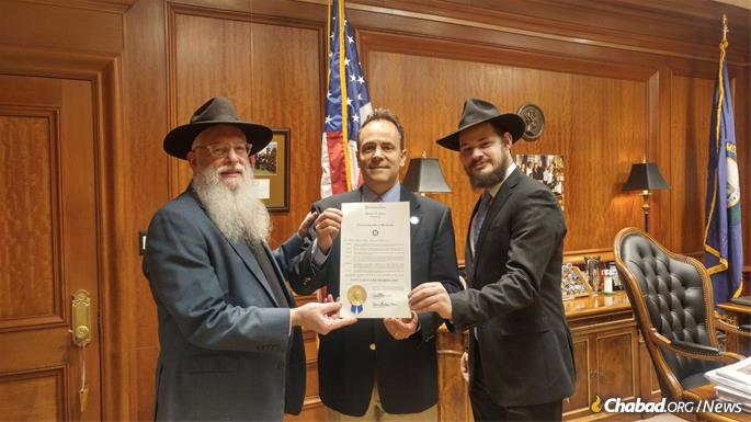 Rabbi Avrohom Litvin, left, and Rabbi Shlomo Litvin with Gov. Matt Bevin of Kentucky.