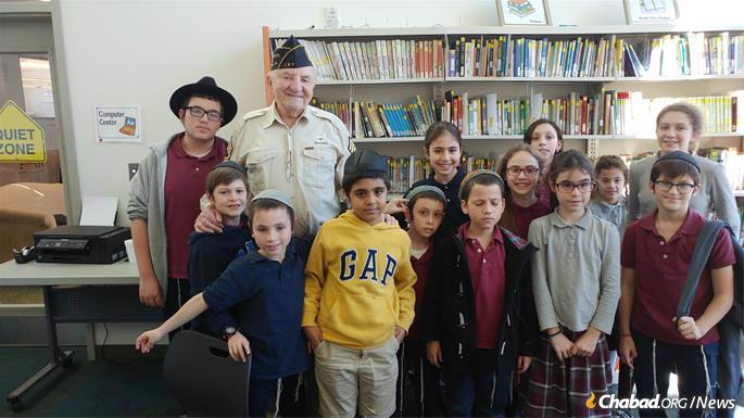 Students meet with a U.S. veteran.