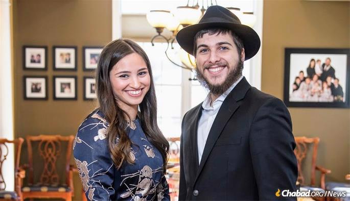 Jacob Niebloom, the sole participant in University of Rochester’s alternative graduation ceremony, with his fiancee, Talia Rosenstrauch.