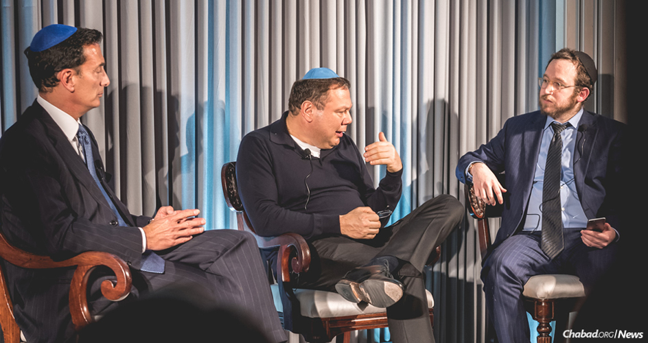 From left: Business leaders and philanthropists Matthew Bronfman and Mikhail Fridman speak about the importance of Torah for Jewish continuity at an event hosted by Rabbi Mendel Kalmenson, Chabad-Lubavitch emissary in the Belgravia section of London. (Photo: Ramis Karamatov)
