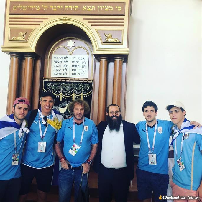 Rabbi Chaim Danzinger shows visitors around the restored Rostov synagogue.