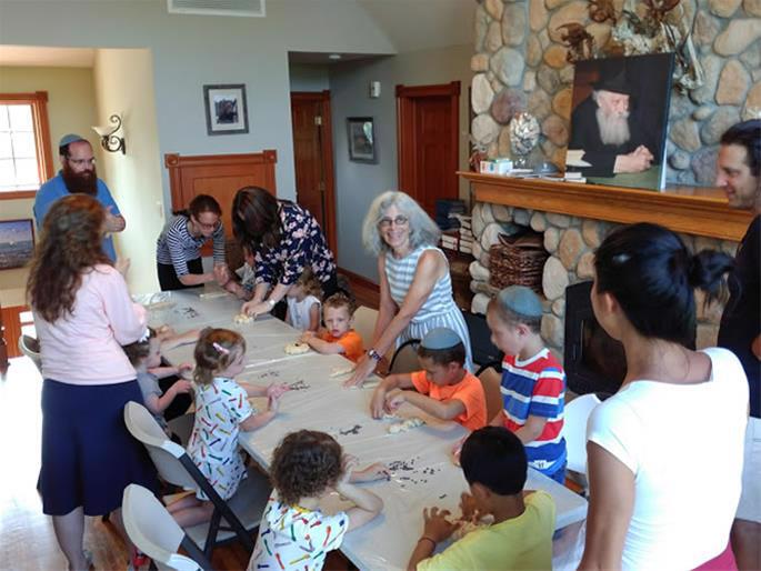 Children, parents and grandparents gather in Montauk to bake challah for Shabbat.