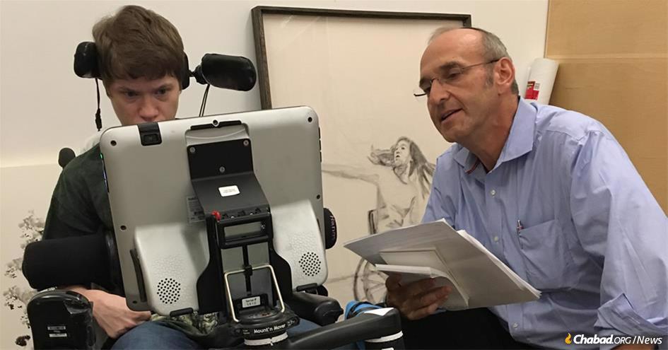 Artist Felicia Bowers being interviewed by writer Howard Blas at the Dresner Soul Studio. Bowers has cerebral palsy, is non-verbal, uses a wheelchair at all times, and communicates—and draws—with assistive technology. Her drawing in the background, ”The Dancer,” which depicts a very active dancer in a wheelchair, recently sold for $14,500.