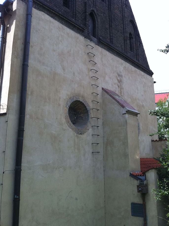 Rear of the Old New Synagogue in Prague, showing rungs leading to the attic where the remains of the Golem are said to have been stored. (Photo: Wikimedia)
