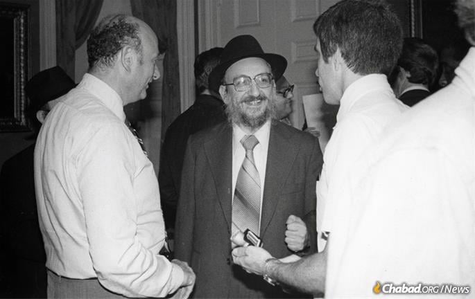 “Our spiritual leader, Rabbi Menachem Schneerson, said 10 years ago we must worry not only about our personal selves but about our community,” Fogelman told the “New York Daily News” in 1976. “If richer people leave, the poor and the elderly remain behind. This is not right. We have decided to stay.” He is seen here with Mayor Ed Koch. (Photo: Fogelman family collection)