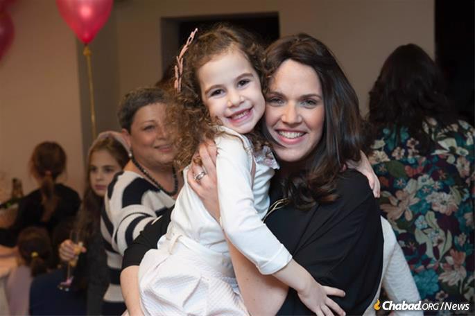 Fruma Ita Wolff and daughter Sara at a bat mitzvah celebration in the pre-renovated Chabad center.