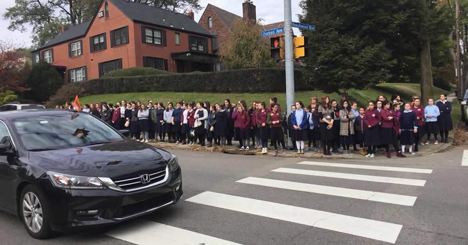 Students of Yeshiva Schools of Pittsburgh pay their respects as the funeral procession of Dr. Jerry Rabinowitz passes through Squirrel Hill.
