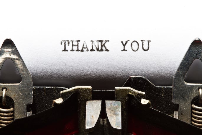 Thank you written on a typewriter sheet.