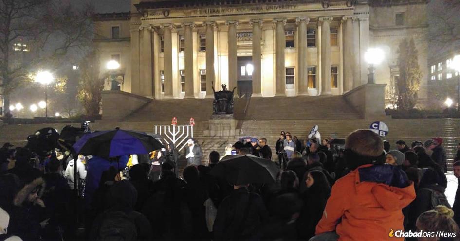 Professor Elizabeth Midlarsky, a psychology and education scholar whose office was vandalized with anti-Semitic images last week, lit the first candle of the Columbia University campus menorah in front of the famed Low Library.