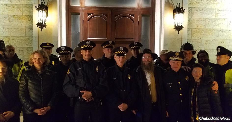 Eleven Pittsburgh police officers, who were among the first responders to the Oct. 27 mass shooting that claimed 11 Jewish lives in a Squirrel Hill synagogue, helped light the menorah at Chabad of Roslyn on Long Island, N.Y.