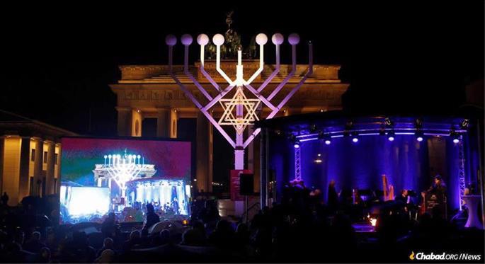 German President Frank-Walter Steinmeier lit the shamash (helper) candle on a menorah erected at the Brandenburg Gate, a site where the Nazis vowed to destroy Judaism.