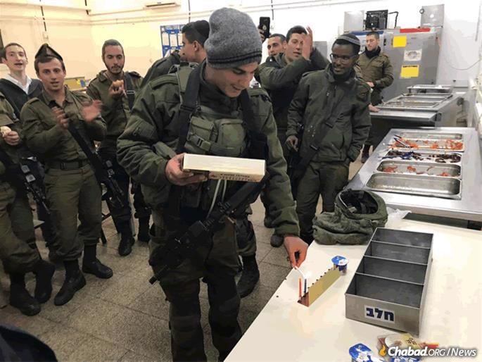 Soldiers were gifted with tin menorahs.