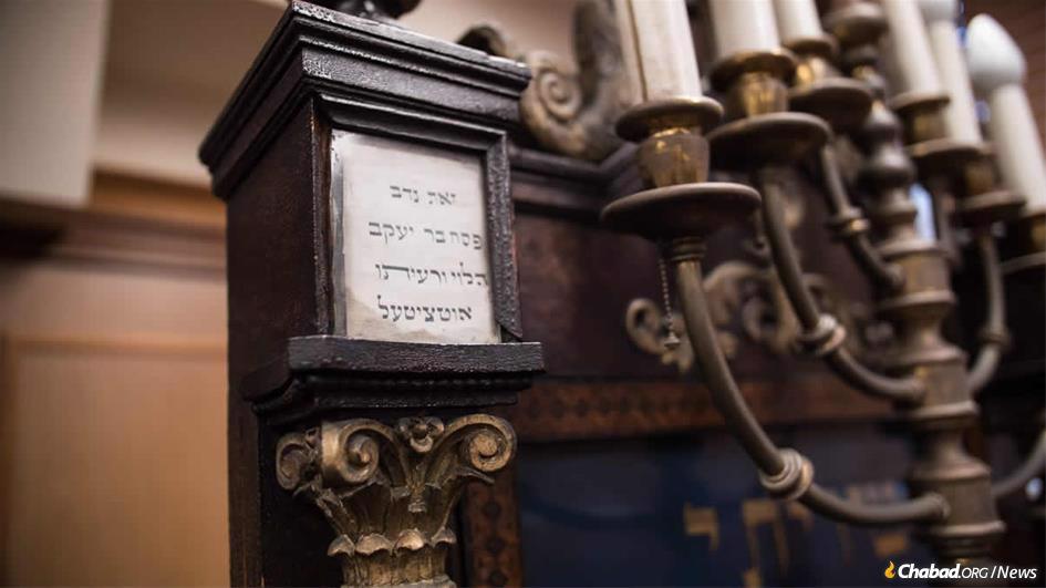 Dedication plaques on antique furniture tell the story of generations of devoted congregants who supported Anshei Lubavitch through the centuries. (Photo: Brett Walkow)