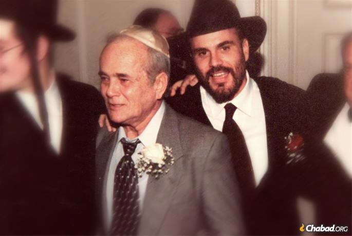 A photo of me and my father at my wedding in 2001.