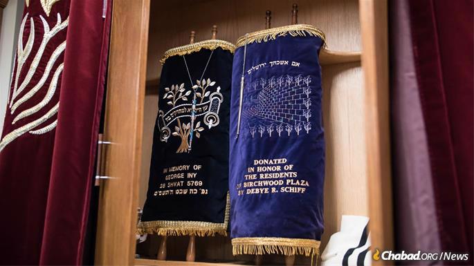 Most of Anshei Lubavitch's Torah scrolls were either found unusable or given to other congregations. The two that remain are housed in an ark that contains some pieces of an earlier ark built by a carpenter who survived the Holocaust and went on to rebuild his life in Chicago. (Photo: Brett Walkow)