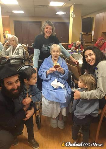 Draizy Junik, right, the Raskins’ daughter, moved back with her husband, Rabbi Eliyahu Junik, left, in 2014 to co-direct programs at Chabad of Vermont. In addition to work with seniors, above, they focus on young professionals and families.
