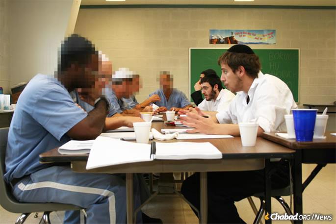 Volunteers and inmates at the Aleph Institute&#39;s regular yeshivah in prison program.