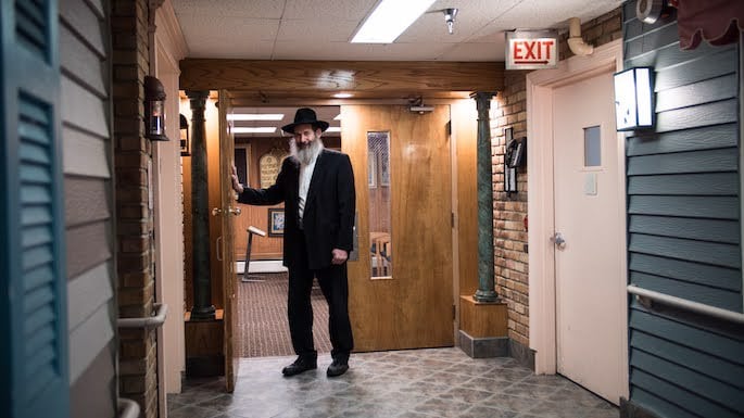 Dr. Lubin stands outside the current home of Anshei Lubavitch. (Photo: Brett Walkow)