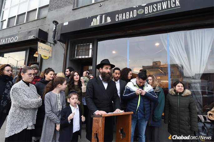 Rabbi Menachem Heller outside the Chabad House whose front window had been smashed on Shabbat a week earlier. (Photo: Todd Maisel)