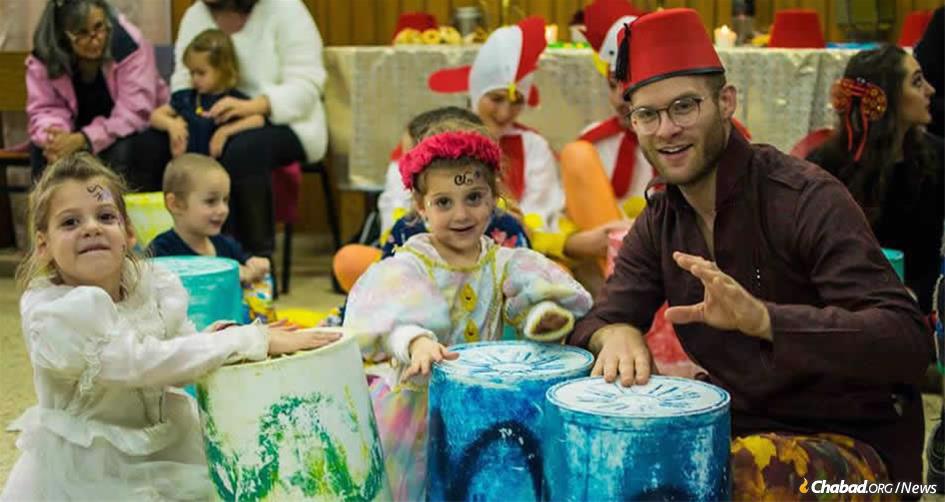 As at this Purim celebration last year at Chabad of the Coast in Tel Aviv, Israel, Jewish people of all ages will be gathering at Chabad centers in large cities, small towns, remote locations and on college campuses around the world to mark the holiday. (Photo: Chabad of the Coast)