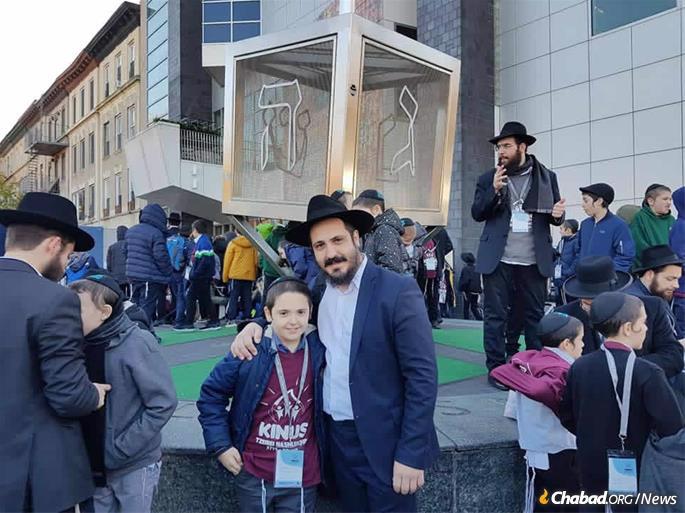 Rabbi Ash and his son at the International Conference of Chabad Lubavitch Emissaries in Brooklyn, N.Y.