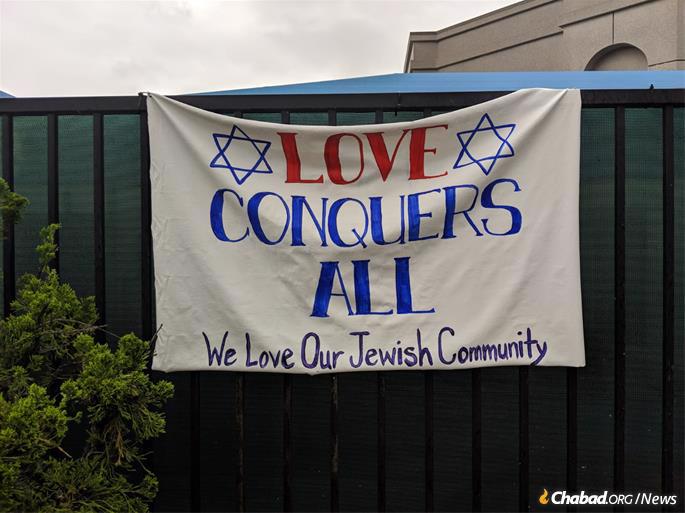Community members put up signs and posters around the site of the attack.