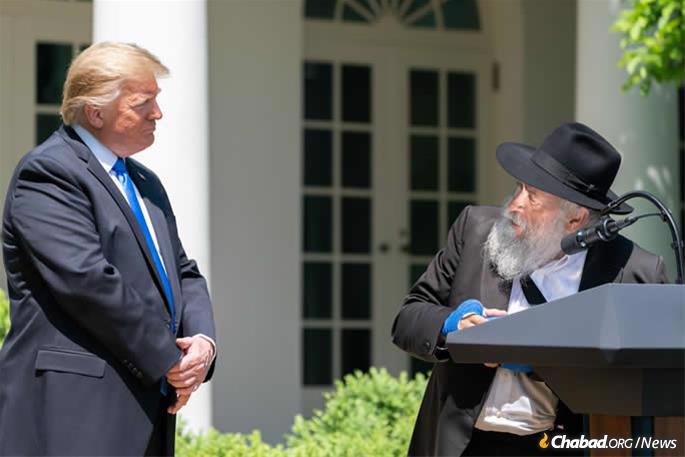 Rabbi Yisroel Goldstein thanks U.S. President Donald Trump for his support and encouragement after the shooting. (Official White House Photo by Tia Dufour)